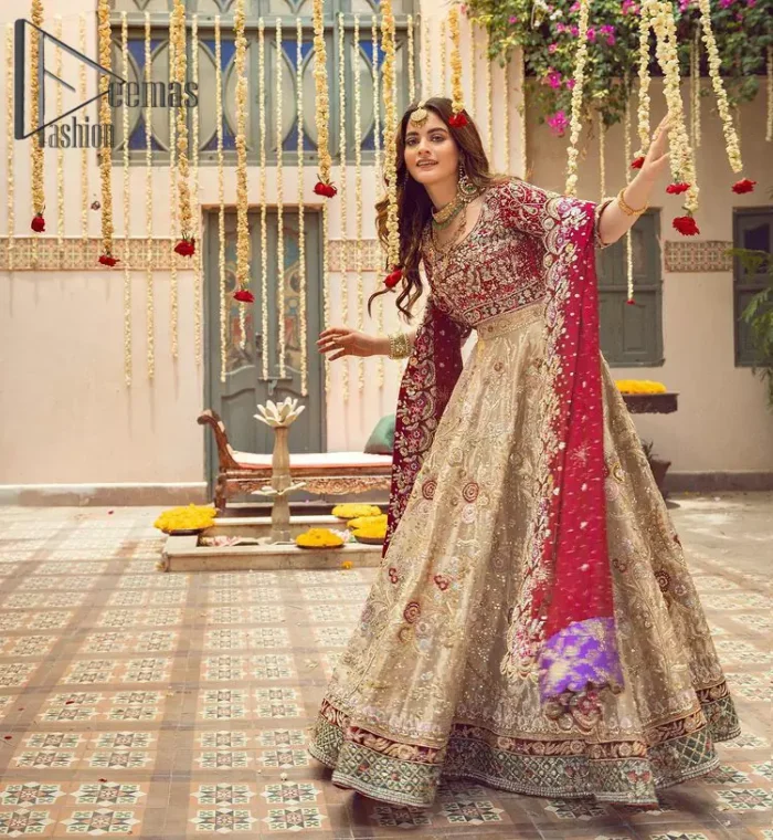 It's distinctive how the new-gen brides are welcoming red and beige shades for their bridal outfits as well. So Welcome your guest to this charming beige lehenga. The three quarter-sleeved Red Blouse  got it all for you. In addition to this, the Beige lehenga have embellished border embroidery and floral embroidery in dabka, kora work that give the stunning look. Furthermore, it is enhanced with embroidered applique bottom. The organza red dupatta that has a scalloped applique border all around the edges makes the look complete and comprehensive.