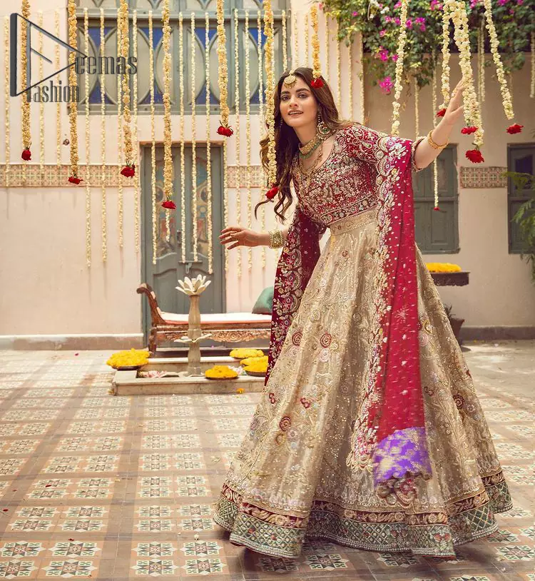 It's distinctive how the new-gen brides are welcoming red and beige shades for their bridal outfits as well. So Welcome your guest to this charming beige lehenga. The three quarter-sleeved Red Blouse  got it all for you. In addition to this, the Beige lehenga have embellished border embroidery and floral embroidery in dabka, kora work that give the stunning look. Furthermore, it is enhanced with embroidered applique bottom. The organza red dupatta that has a scalloped applique border all around the edges makes the look complete and comprehensive.