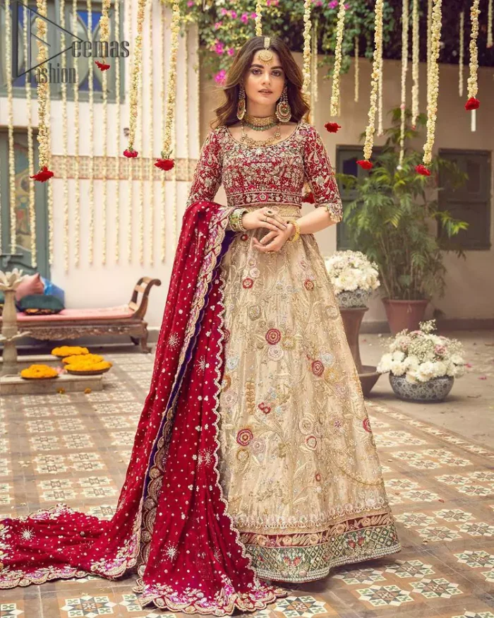 It's distinctive how the new-gen brides are welcoming red and beige shades for their bridal outfits as well. So Welcome your guest to this charming beige lehenga. The three quarter-sleeved Red Blouse  got it all for you. In addition to this, the Beige lehenga have embellished border embroidery and floral embroidery in dabka, kora work that give the stunning look. Furthermore, it is enhanced with embroidered applique bottom. The organza red dupatta that has a scalloped applique border all around the edges makes the look complete and comprehensive.