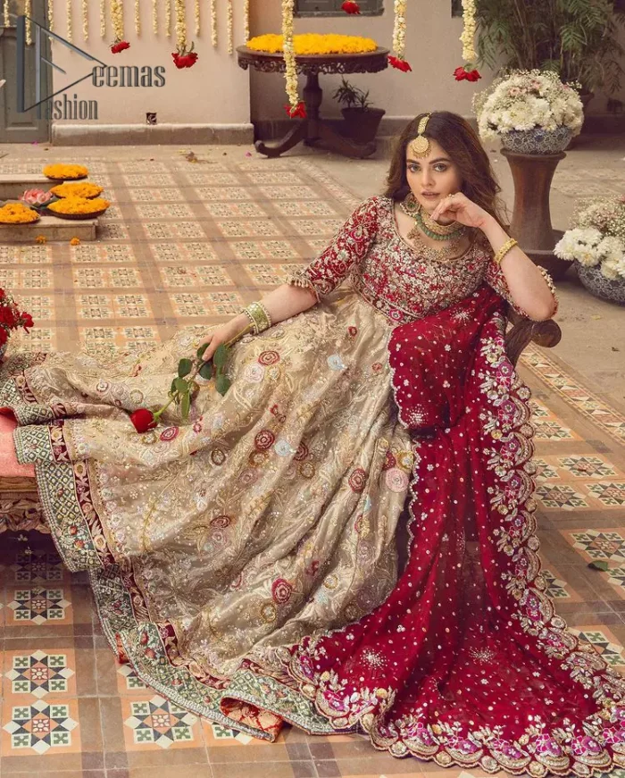 It's distinctive how the new-gen brides are welcoming red and beige shades for their bridal outfits as well. So Welcome your guest to this charming beige lehenga. The three quarter-sleeved Red Blouse  got it all for you. In addition to this, the Beige lehenga have embellished border embroidery and floral embroidery in dabka, kora work that give the stunning look. Furthermore, it is enhanced with embroidered applique bottom. The organza red dupatta that has a scalloped applique border all around the edges makes the look complete and comprehensive.