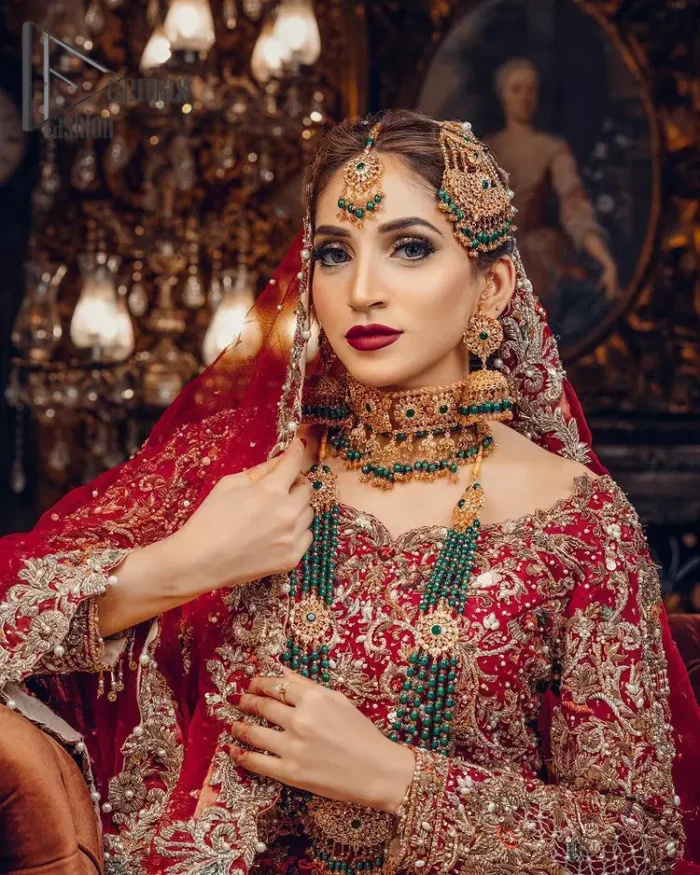Just living is not enough, one must have sunshine, romance and a little magic on your big day. So add super magic to your big day with this Red article on Deemas Fashion. This lovely red blouse that has a sweetheart neckline is fully embellished with kora, dabka and tilla embroidery. It is synchronized with a can-can lehenga that celebrates your character as well. Furthermore, this remarkable red can-can lehenga is fully embellished with golden and dark antique embroidery that gives you extraordinary beauty. As every bride prefer the right texture so we pair up this article with an organza red dupatta that have sequins spray all around that gives a delightful feeling.