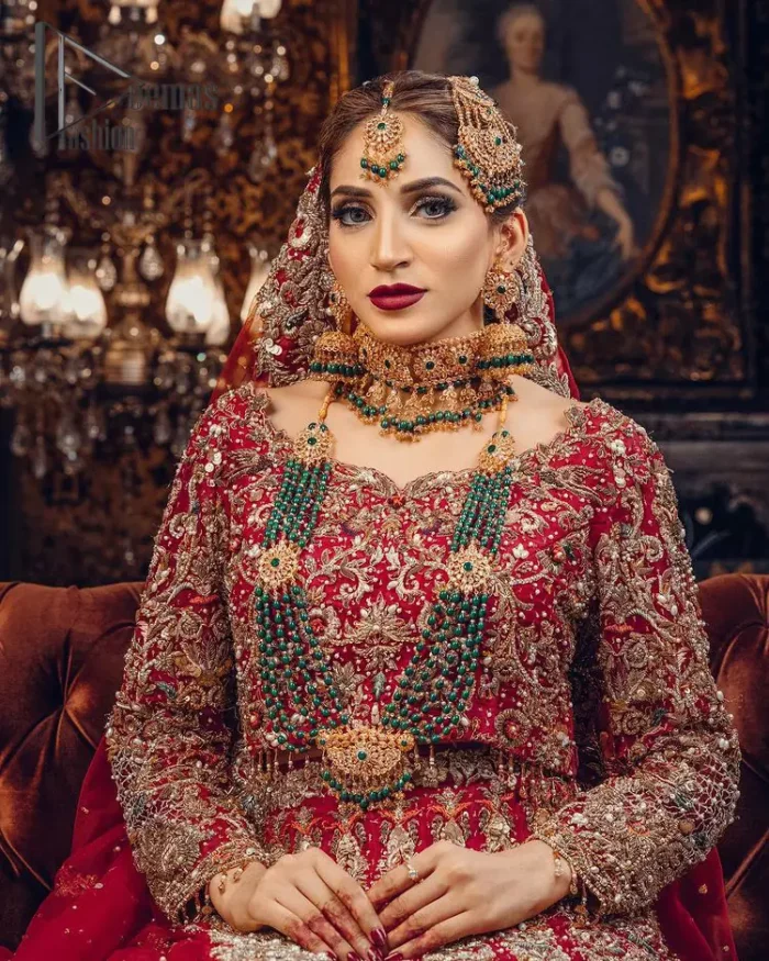 Just living is not enough, one must have sunshine, romance and a little magic on your big day. So add super magic to your big day with this Red article on Deemas Fashion. This lovely red blouse that has a sweetheart neckline is fully embellished with kora, dabka and tilla embroidery. It is synchronized with a can-can lehenga that celebrates your character as well. Furthermore, this remarkable red can-can lehenga is fully embellished with golden and dark antique embroidery that gives you extraordinary beauty. As every bride prefer the right texture so we pair up this article with an organza red dupatta that have sequins spray all around that gives a delightful feeling.