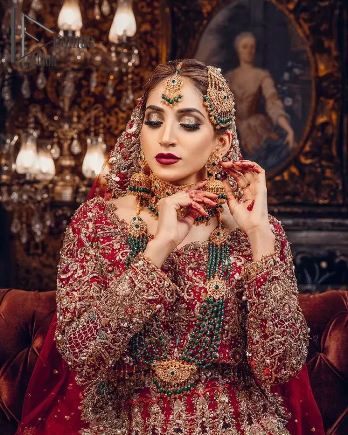 Just living is not enough, one must have sunshine, romance and a little magic on your big day. So add super magic to your big day with this Red article on Deemas Fashion. This lovely red blouse that has a sweetheart neckline is fully embellished with kora, dabka and tilla embroidery. It is synchronized with a can-can lehenga that celebrates your character as well. Furthermore, this remarkable red can-can lehenga is fully embellished with golden and dark antique embroidery that gives you extraordinary beauty. As every bride prefer the right texture so we pair up this article with an organza red dupatta that have sequins spray all around that gives a delightful feeling.