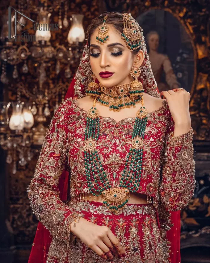 Just living is not enough, one must have sunshine, romance and a little magic on your big day. So add super magic to your big day with this Red article on Deemas Fashion. This lovely red blouse that has a sweetheart neckline is fully embellished with kora, dabka and tilla embroidery. It is synchronized with a can-can lehenga that celebrates your character as well. Furthermore, this remarkable red can-can lehenga is fully embellished with golden and dark antique embroidery that gives you extraordinary beauty. As every bride prefer the right texture so we pair up this article with an organza red dupatta that have sequins spray all around that gives a delightful feeling.