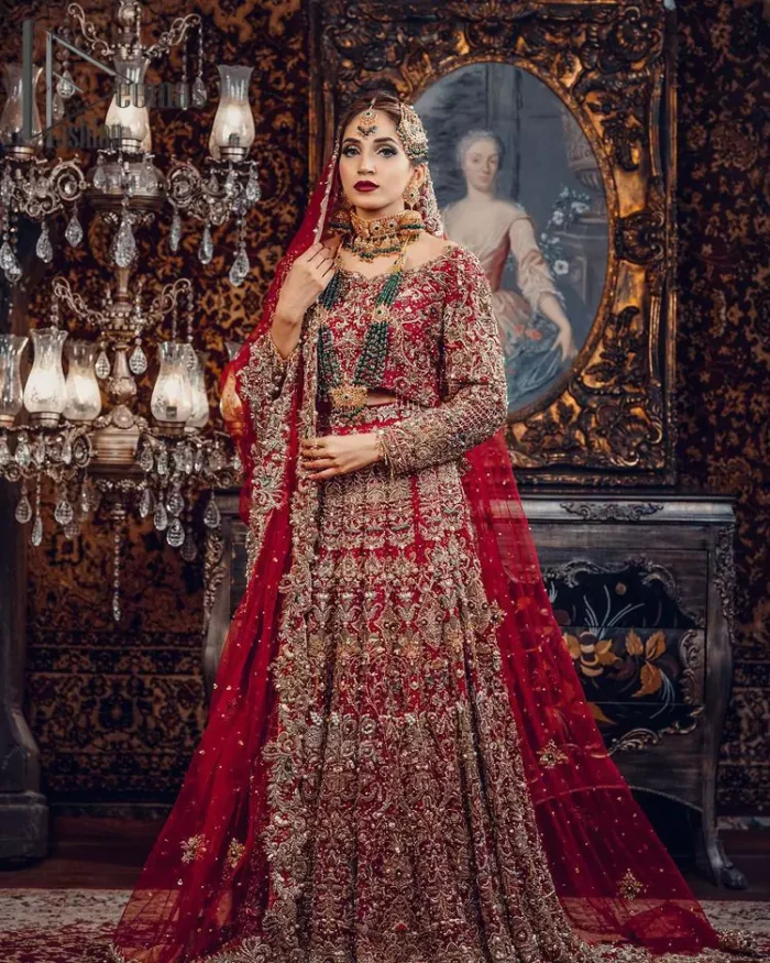 Just living is not enough, one must have sunshine, romance and a little magic on your big day. So add super magic to your big day with this Red article on Deemas Fashion. This lovely red blouse that has a sweetheart neckline is fully embellished with kora, dabka and tilla embroidery. It is synchronized with a can-can lehenga that celebrates your character as well. Furthermore, this remarkable red can-can lehenga is fully embellished with golden and dark antique embroidery that gives you extraordinary beauty. As every bride prefer the right texture so we pair up this article with an organza red dupatta that have sequins spray all around that gives a delightful feeling.