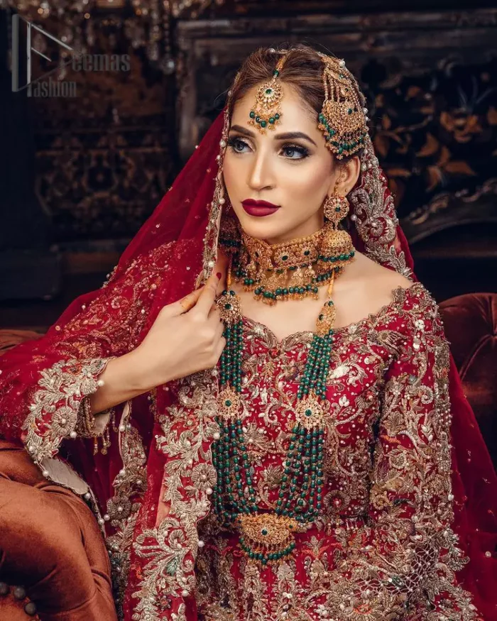 Just living is not enough, one must have sunshine, romance and a little magic on your big day. So add super magic to your big day with this Red article on Deemas Fashion. This lovely red blouse that has a sweetheart neckline is fully embellished with kora, dabka and tilla embroidery. It is synchronized with a can-can lehenga that celebrates your character as well. Furthermore, this remarkable red can-can lehenga is fully embellished with golden and dark antique embroidery that gives you extraordinary beauty. As every bride prefer the right texture so we pair up this article with an organza red dupatta that have sequins spray all around that gives a delightful feeling.