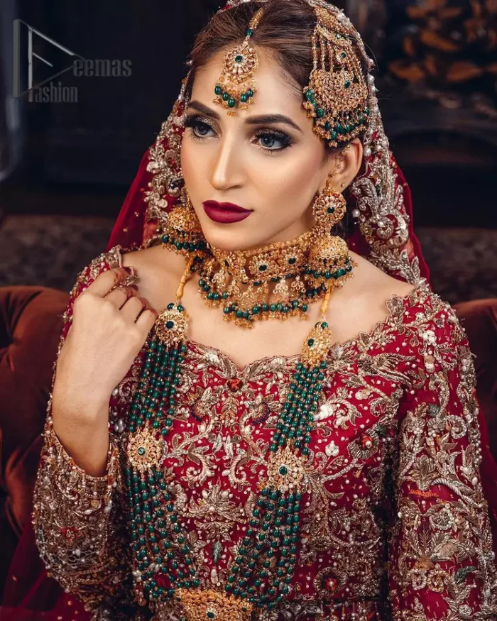 Just living is not enough, one must have sunshine, romance and a little magic on your big day. So add super magic to your big day with this Red article on Deemas Fashion. This lovely red blouse that has a sweetheart neckline is fully embellished with kora, dabka and tilla embroidery. It is synchronized with a can-can lehenga that celebrates your character as well. Furthermore, this remarkable red can-can lehenga is fully embellished with golden and dark antique embroidery that gives you extraordinary beauty. As every bride prefer the right texture so we pair up this article with an organza red dupatta that have sequins spray all around that gives a delightful feeling.