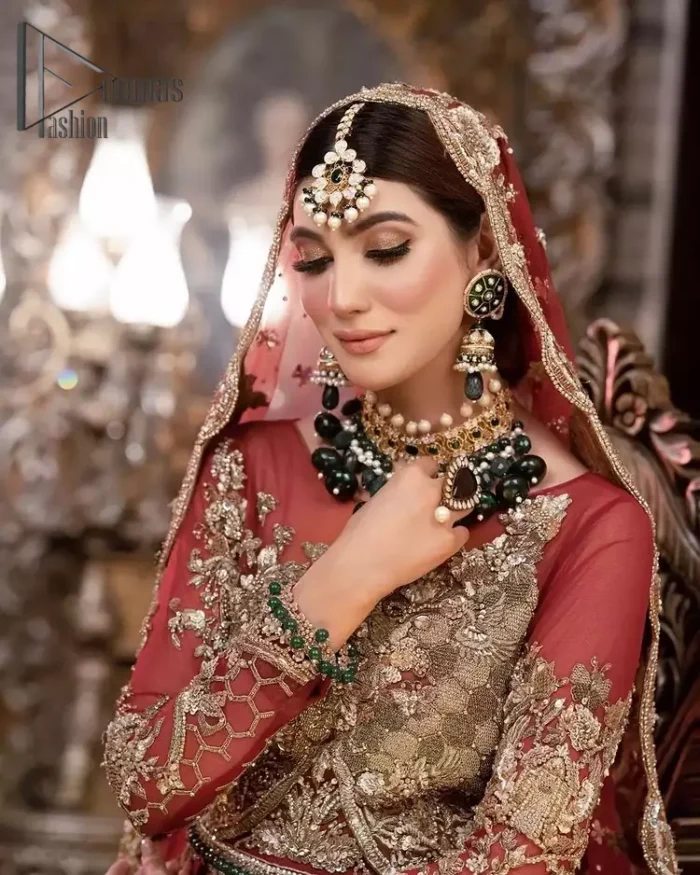 Take your style up a few notches with this bold yet elegant piece on your Big day. This red full sleeves habitual blouse choli is remarkably made with pure organza, styled easily and graciously with boat shape neckline and fully embellished with tilla, kora , dabka work. In addition to this, the frilled lehenga is also fully embellished with heavy embroidery that perfectly enhance your dazzling style on your big day. Finish this look with a red dupatta that have sequins spray all around and embellished with a four-sided scalloped border as well.