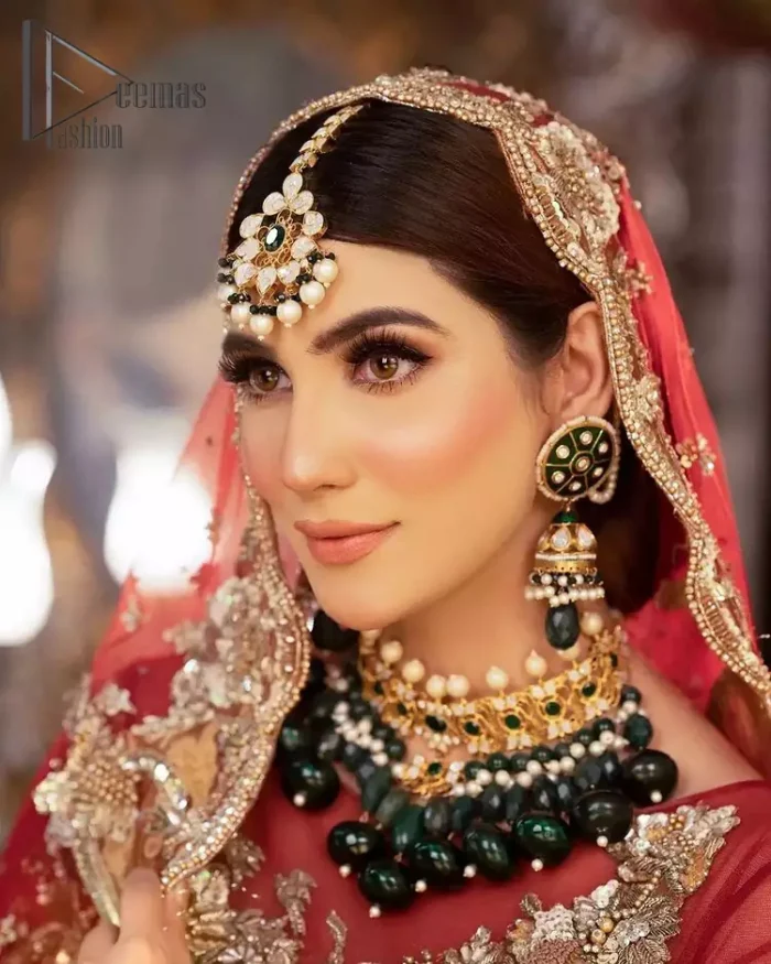 Take your style up a few notches with this bold yet elegant piece on your Big day. This red full sleeves habitual blouse choli is remarkably made with pure organza, styled easily and graciously with boat shape neckline and fully embellished with tilla, kora , dabka work. In addition to this, the frilled lehenga is also fully embellished with heavy embroidery that perfectly enhance your dazzling style on your big day. Finish this look with a red dupatta that have sequins spray all around and embellished with a four-sided scalloped border as well.