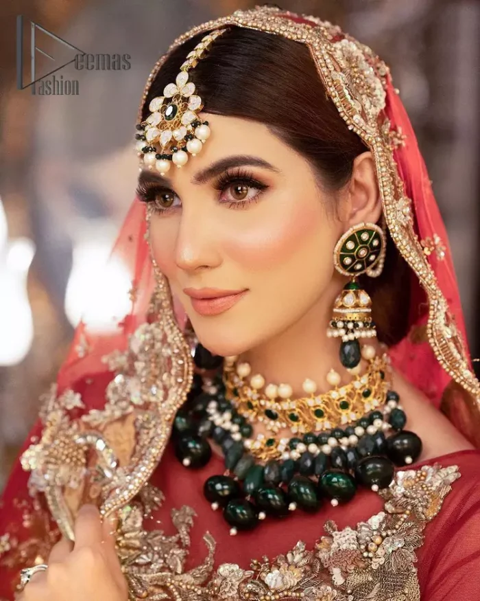 Take your style up a few notches with this bold yet elegant piece on your Big day. This red full sleeves habitual blouse choli is remarkably made with pure organza, styled easily and graciously with boat shape neckline and fully embellished with tilla, kora , dabka work. In addition to this, the frilled lehenga is also fully embellished with heavy embroidery that perfectly enhance your dazzling style on your big day. Finish this look with a red dupatta that have sequins spray all around and embellished with a four-sided scalloped border as well.
