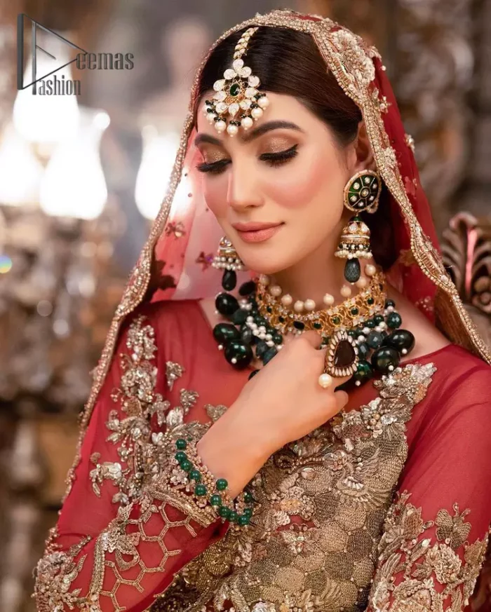 Take your style up a few notches with this bold yet elegant piece on your Big day. This red full sleeves habitual blouse choli is remarkably made with pure organza, styled easily and graciously with boat shape neckline and fully embellished with tilla, kora , dabka work. In addition to this, the frilled lehenga is also fully embellished with heavy embroidery that perfectly enhance your dazzling style on your big day. Finish this look with a red dupatta that have sequins spray all around and embellished with a four-sided scalloped border as well.