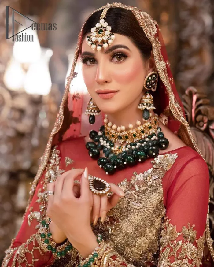 Take your style up a few notches with this bold yet elegant piece on your Big day. This red full sleeves habitual blouse choli is remarkably made with pure organza, styled easily and graciously with boat shape neckline and fully embellished with tilla, kora , dabka work. In addition to this, the frilled lehenga is also fully embellished with heavy embroidery that perfectly enhance your dazzling style on your big day. Finish this look with a red dupatta that have sequins spray all around and embellished with a four-sided scalloped border as well.