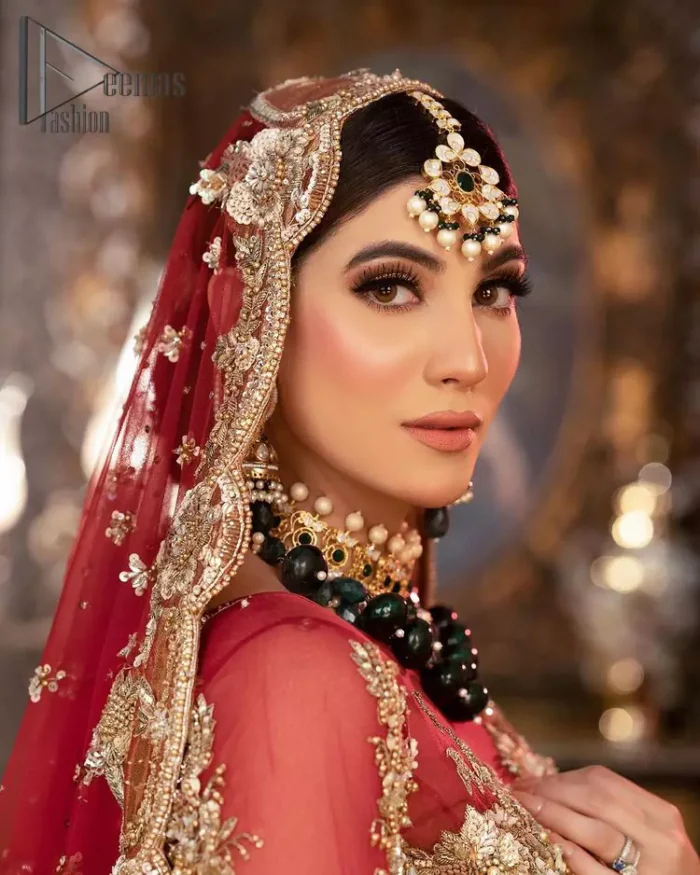 Take your style up a few notches with this bold yet elegant piece on your Big day. This red full sleeves habitual blouse choli is remarkably made with pure organza, styled easily and graciously with boat shape neckline and fully embellished with tilla, kora , dabka work. In addition to this, the frilled lehenga is also fully embellished with heavy embroidery that perfectly enhance your dazzling style on your big day. Finish this look with a red dupatta that have sequins spray all around and embellished with a four-sided scalloped border as well.