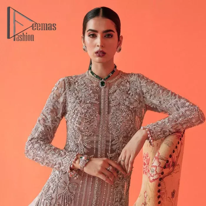If you have a galaxy in your eyes, and immense love in your heart for your outfits then this beautiful tea rose article is just for you. This full sleeves tea rose shirt is highlighted with kora, dabka and crystal embroidery. Furthermore, Its long open-front style is looking glamorous when it pairs up with the prettiest tea rose lehenga just embellished with tiny floral motifs that give you a super-duper fairy dreamy look on any special occasion. To finish the look, go with an organza dupatta decorated with sequins spray all over.