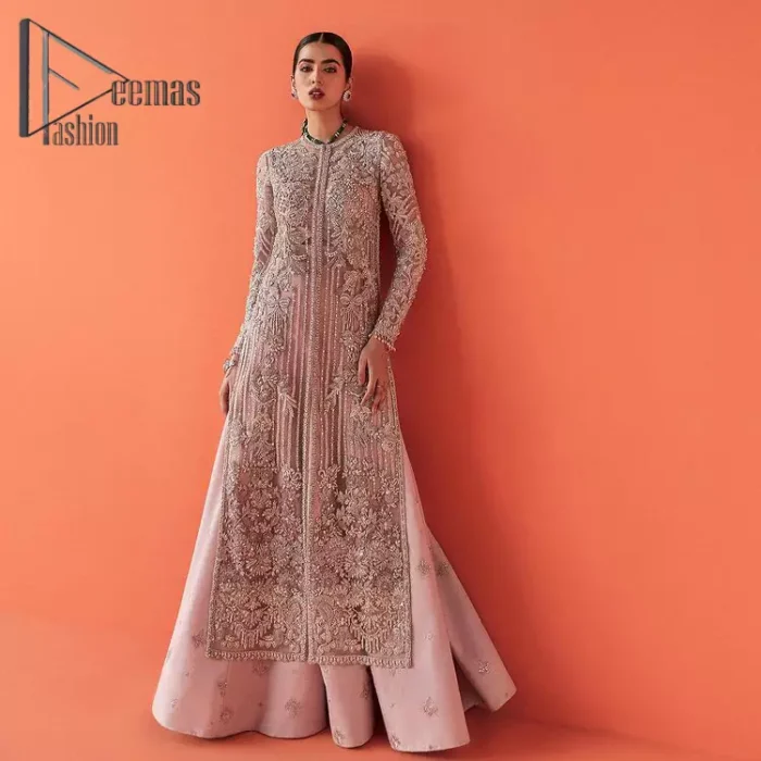 If you have a galaxy in your eyes, and immense love in your heart for your outfits then this beautiful tea rose article is just for you. This full sleeves tea rose shirt is highlighted with kora, dabka and crystal embroidery. Furthermore, Its long open-front style is looking glamorous when it pairs up with the prettiest tea rose lehenga just embellished with tiny floral motifs that give you a super-duper fairy dreamy look on any special occasion. To finish the look, go with an organza dupatta decorated with sequins spray all over.