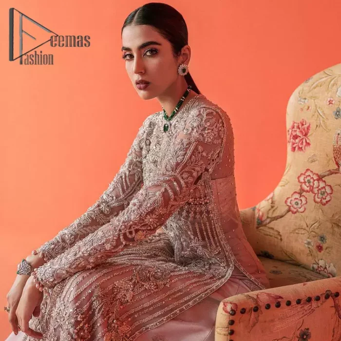 If you have a galaxy in your eyes, and immense love in your heart for your outfits then this beautiful tea rose article is just for you. This full sleeves tea rose shirt is highlighted with kora, dabka and crystal embroidery. Furthermore, Its long open-front style is looking glamorous when it pairs up with the prettiest tea rose lehenga just embellished with tiny floral motifs that give you a super-duper fairy dreamy look on any special occasion. To finish the look, go with an organza dupatta decorated with sequins spray all over.