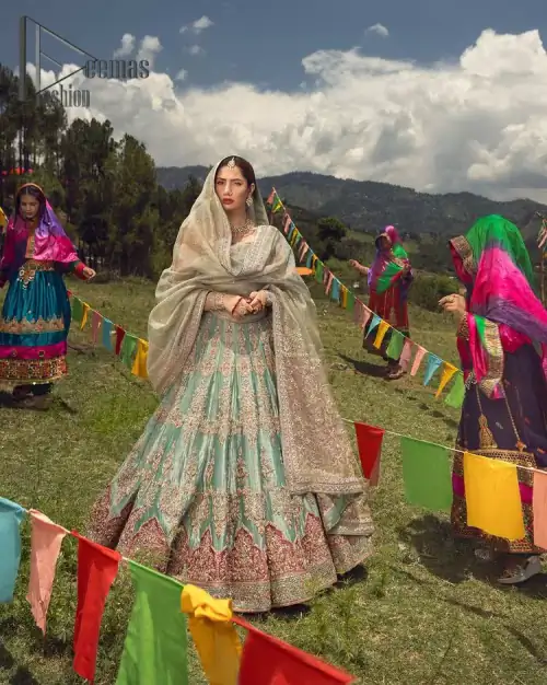 Talking about traditional, Deemas Fashion introduces the Aqua Lehenga and pink blouse which is an outstanding upgrade to bridal wear.