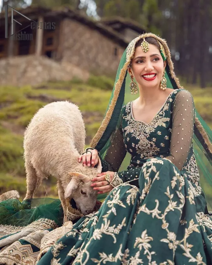 The eccentric Bottle Green outfit sings a melody just for you! The ghrara in bottle green is enriched with golden embroidery to create a modern vibe. This surprising full-sleeved shirt presents an outstanding sweetheart neckline, embellished with the finest work of golden and silver embroidery, and adorned with pearls while the details make it perfectly festive. Style it up with an organza dupatta which is sprinkled with sequins all over and four sides Kiran to give it a dreamy legal and royal look.