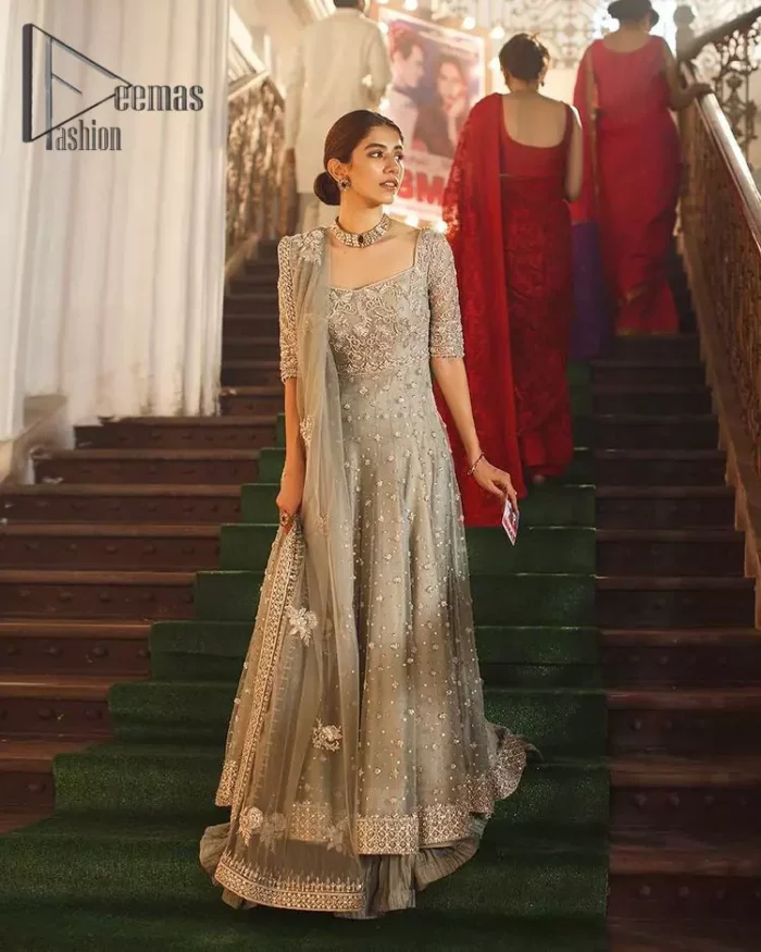 Exceptionally styled and symphonized stitching makes you gorgeous enough that it would surely make your big days remembering one. The Gray Pishwas Frock is a true beauty when it comes to the work of perfection. This Half Sleeves fit and flare attire is made to brighten up your persona with its finest adornments under its charming sweetheart neckline. It comprises gray crushed sharara and organza dupatta ornamented with a four-sided embellished border.