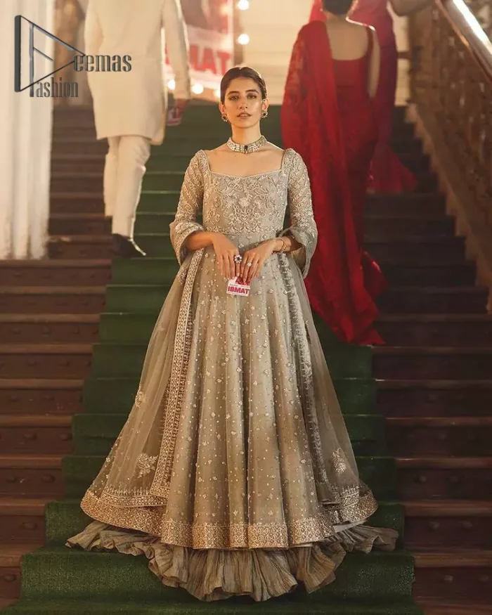 Exceptionally styled and symphonized stitching makes you gorgeous enough that it would surely make your big days remembering one. The Gray Pishwas Frock is a true beauty when it comes to the work of perfection. This Half Sleeves fit and flare attire is made to brighten up your persona with its finest adornments under its charming sweetheart neckline. It comprises gray crushed sharara and organza dupatta ornamented with a four-sided embellished border.