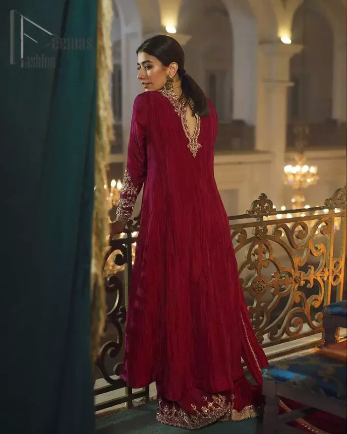 A picture of pure elegance with maroon crushed frock enhanced with embellished golden embroidered neckline. The neckline is adorned with golden kora, dabka and tilla work. Beautifully paired up with palazzo delicately crafted with embroidery on the border. With a lot of attention to detail, the intricate zardozi work using zardozi work and tilla makes the dress look like nothing but a dream. Dupatta is emphasized with lace all around the borders.