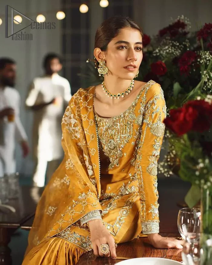 As we seek outside the wonders we carry inside us. So, to attain that wonders Demaas Fashion introduces Mustard short shirt and Sharara. A Short shirt featuring a stunning front, full sleeves, and remarkable embroidery on a round neckline, initiates the attractiveness of this dress. Further, the apparel displays light golden embroidery that brightens up its victorious look. Finish this look with an organza dupatta with an embellished border that increases the beauty of this outfit. Sharara is emphasized with intricate embroidery on the border and scattered floral motifs.