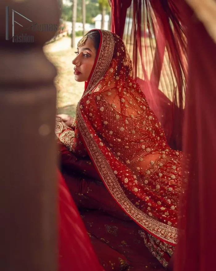 Make your moment memorable by being a dreamy lady in this red can-can lehenga boost with floral motifs. This dreamy can-can lehenga is adorned with golden kora, dabka, tilla, sequins and resham thread work which gave a perfect ending to this flare. In addition to this, the blouse is fully embellished with zardozi work. Finish the look with a red dupatta having four-sided embellished borders scattered with tiny floral motifs and sequins spray all over the ground.
