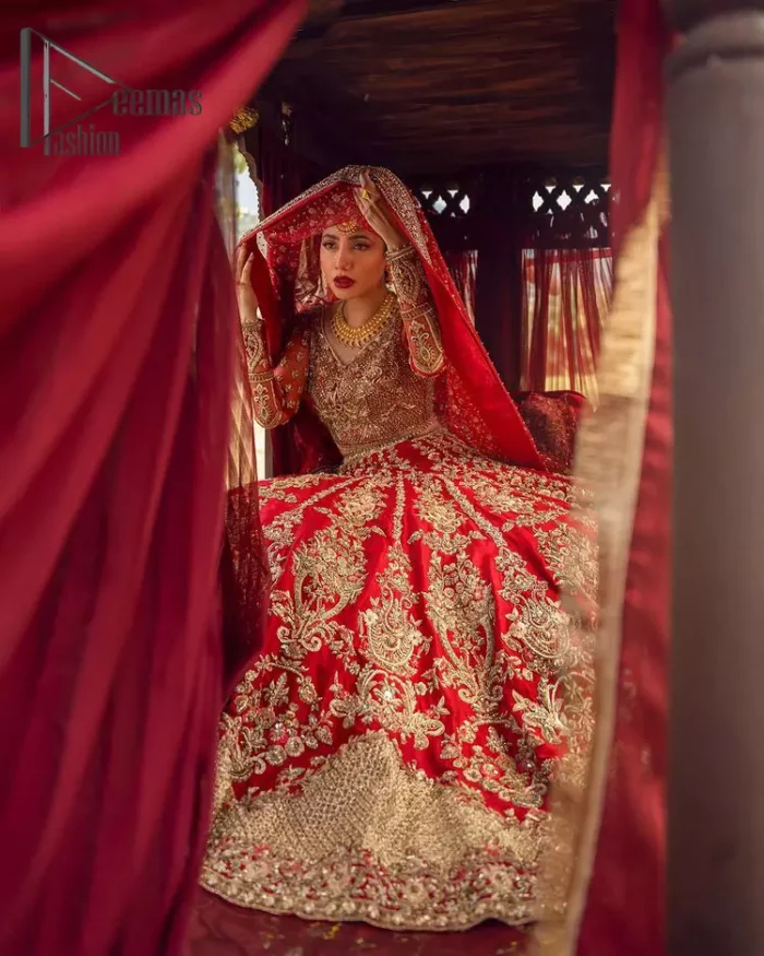 Make your moment memorable by being a dreamy lady in this red can-can lehenga boost with floral motifs. This dreamy can-can lehenga is adorned with golden kora, dabka, tilla, sequins and resham thread work which gave a perfect ending to this flare. In addition to this, the blouse is fully embellished with zardozi work. Finish the look with a red dupatta having four-sided embellished borders scattered with tiny floral motifs and sequins spray all over the ground.