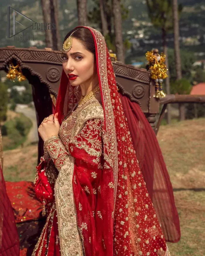 Make your moment memorable by being a dreamy lady in this red can-can lehenga boost with floral motifs. This dreamy can-can lehenga is adorned with golden kora, dabka, tilla, sequins and resham thread work which gave a perfect ending to this flare. In addition to this, the blouse is fully embellished with zardozi work. Finish the look with a red dupatta having four-sided embellished borders scattered with tiny floral motifs and sequins spray all over the ground.