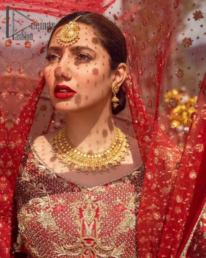 Make your moment memorable by being a dreamy lady in this red can-can lehenga boost with floral motifs. This dreamy can-can lehenga is adorned with golden kora, dabka, tilla, sequins and resham thread work which gave a perfect ending to this flare. In addition to this, the blouse is fully embellished with zardozi work. Finish the look with a red dupatta having four-sided embellished borders scattered with tiny floral motifs and sequins spray all over the ground.