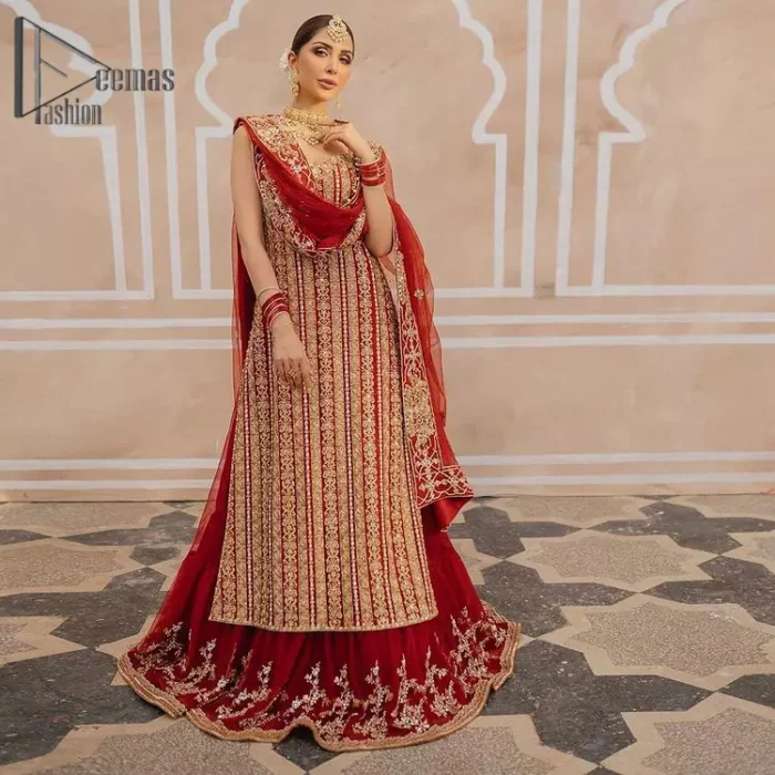 This stunning wedding dress offers comfort without compromising on style. The outfit is laden with golden zardozi work all over the shirt. embroidery creates such a dreamy touch to your big day. Paired up with a red lehenga adorned with floral bunches all around the flare creates an unusual design. Embroidery is done in the shade of golden. Dupatta is accentuated with sequins spray all over and hand-embellished floral jhaal all around the borders.
