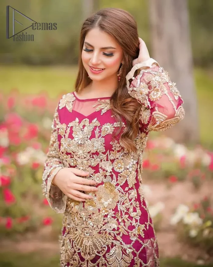 Take a step towards refreshing your wardrobe with a Shocking pink long Shirt. This dress is allured with floral embroidery. It is further enhanced with kora, dabka, kundan, sequins and pearls. It comes with raw silk trousers and enhances the art of classical heritage showcasing the craftsmanship of zardozi work on the bottom. Artistically embellished to give a beautiful rhythm to the outfit. This outfit is a perfect choice for daylight but equally breathtaking for night events.