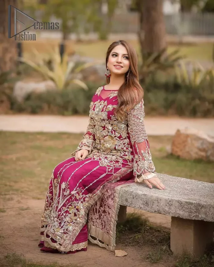Take a step towards refreshing your wardrobe with a Shocking pink long Shirt. This dress is allured with floral embroidery. It is further enhanced with kora, dabka, kundan, sequins and pearls. It comes with raw silk trousers and enhances the art of classical heritage showcasing the craftsmanship of zardozi work on the bottom. Artistically embellished to give a beautiful rhythm to the outfit. This outfit is a perfect choice for daylight but equally breathtaking for night events.