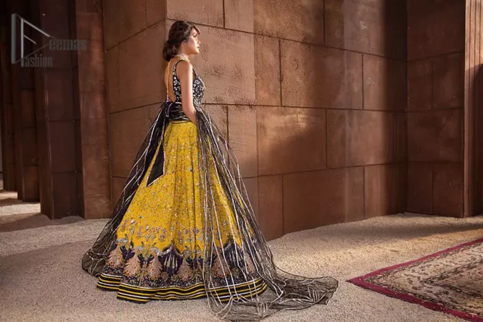 You smelled like sunshine and daisies when this pure magic wrapped around as our embroidery is luxurious. Yellow and black is the super trend of mehndi occasions. This eye-catching sleeveless black blouse having boat shape neckline looks priceless in silver and golden embroidery. In addition to this, yellow lehenga embellished with kora, dabka and sequins work and beautifully designed borders with zardozi, applique and Kiran shows the feeling of mehndi bride. Pair it up with a black dupatta that you would definitely want to wear for your next event.
