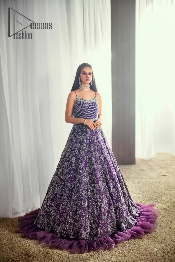 Evening parties being full of entertainment are maxed up with gratification if your dress wins you the most admirers. This sleeveless Purple Frilled Maxi has the magical features to make you an evening star. Decorated with silver embroidery  and crisscross patterns, its stunning boat-shaped neckline suits its highly enchanting silver embroidery.