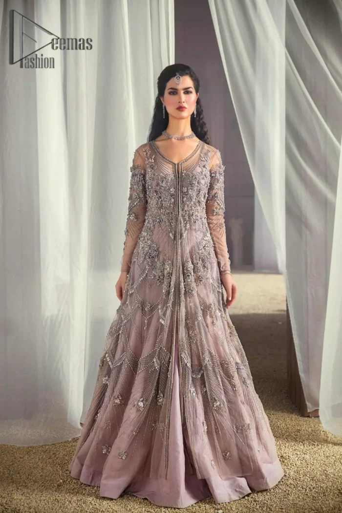 We like vibrance and sometimes you need a bit more vibrance to set the look. So, here we introduce a very vibrant tea pink front open maxi that embraces the season of festive. The maxi has a front open design embellished with crystal, kora, sequins work that serves with full sleeves and gives you a super-duper aesthetic look. Comes up with a fussed lehenga in the same colour. Finish this look with a tea pink net dupatta having sequins spray all over that increasing your dreamy vibrancy.