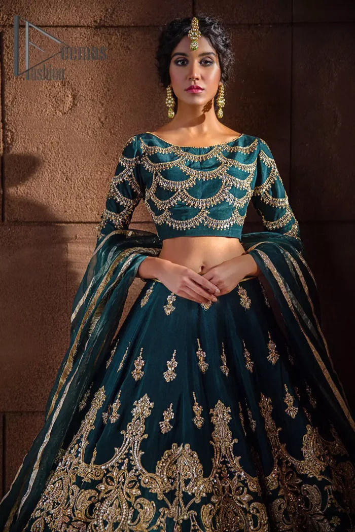 Make your day swirl and twirl in our teal blue outfit. This full sleeves teal blue blouse embellished with kora, dabka and tilla work looks stunning. Further, the boat shape neckline of this blouse is based on floral embroidery and made with pure organza. The dress accompanies a fascinating organza dupatta to perfect the beautiful formal wear. It is highlighted with a lehenga that has the power to make your look even just like the delphinium flower. The outfit enhances its beauty due to its uniqueness and the perfect fusion of modern cut and traditional embroidery.