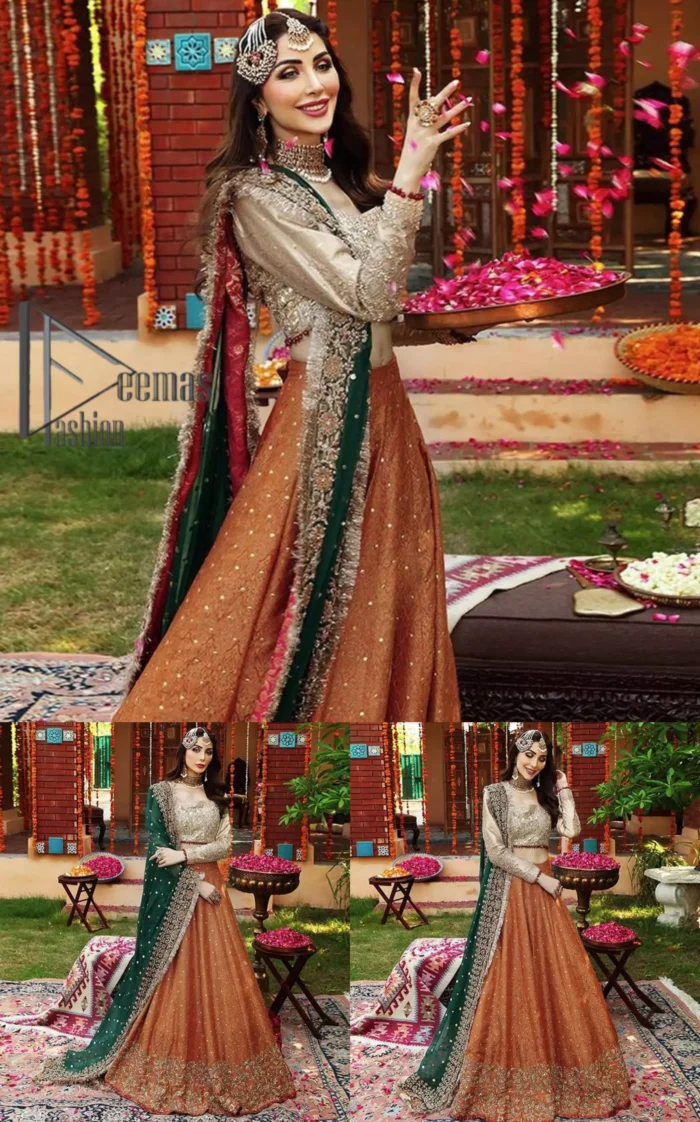 You have got plans for your mehndi? DeemasFashion got you to look!  Just go bold and bright with a beige blouse that is garnished with the same color thread embroidery and the blouse is highlighted with a square neckline and full sleeves. Further, the bottom of the blouse is adorned with red pearls that grant you a brilliant look. It is paired up with an orange lehenga that border is attractively enriched with golden embroidery and sequins spray all over. Finish this look with a green dupatta that is sprinkled with a four-sided Kiran and four sider border as well.