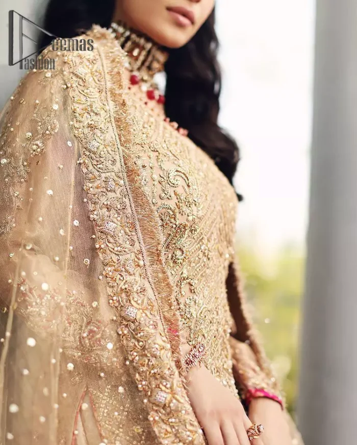 As Love Struck is a true wink of adoration so every nikkah bride is an emotion of love and a glimpse of glory shines when comes to fawn color just like a diamond. This fawn long shirt is attractively decorated with the same color embroidery that includes tilla, kora, dabka work just to give you a loving and attractive look. It is glamourously prominent with a round neckline and full sleeves as every bride wants. Pair it up with priceless fawn gharara which is made with pure Katan banarsi jamawar. Finish this outfit with a fawn dupatta that is adorned with four-sided Kiran and beautiful lace as well.