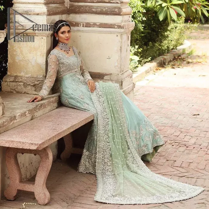 Stressed about your outfit on Walima?  Deemas Fashion will save your day. Make your moments more memorable with our ice blue front open maxi that is adorned with silver tilla, kora, and crystal work to enhance the beauty of maxi. In addition to this, the beauty of the square neckline of the stunning maxi speaks itself on your day. It is synchronized with the lehenga that's the border is as pretty as look in the picture. Finish this look with a dupatta that personifies the delicate embroidery on four sides and sequins detailing all over just to save your memorable day and give you a fairy look.