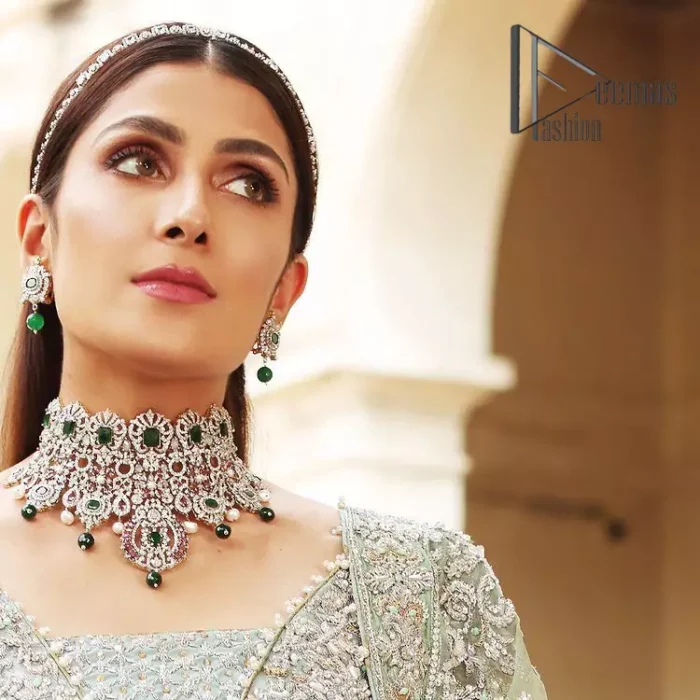 Stressed about your outfit on Walima?  Deemas Fashion will save your day. Make your moments more memorable with our ice blue front open maxi that is adorned with silver tilla, kora, and crystal work to enhance the beauty of maxi. In addition to this, the beauty of the square neckline of the stunning maxi speaks itself on your day. It is synchronized with the lehenga that's the border is as pretty as look in the picture. Finish this look with a dupatta that personifies the delicate embroidery on four sides and sequins detailing all over just to save your memorable day and give you a fairy look.