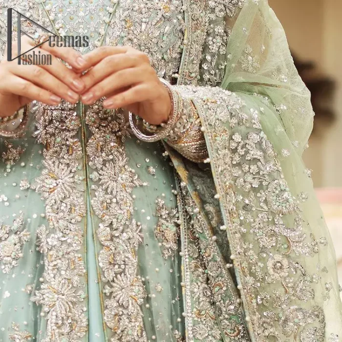 Stressed about your outfit on Walima?  Deemas Fashion will save your day. Make your moments more memorable with our ice blue front open maxi that is adorned with silver tilla, kora, and crystal work to enhance the beauty of maxi. In addition to this, the beauty of the square neckline of the stunning maxi speaks itself on your day. It is synchronized with the lehenga that's the border is as pretty as look in the picture. Finish this look with a dupatta that personifies the delicate embroidery on four sides and sequins detailing all over just to save your memorable day and give you a fairy look.