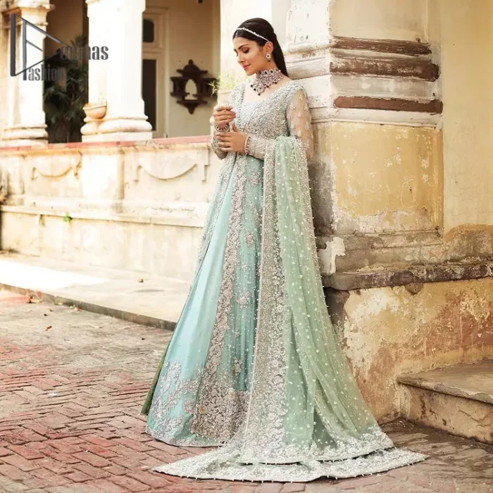 Stressed about your outfit on Walima?  Deemas Fashion will save your day. Make your moments more memorable with our ice blue front open maxi that is adorned with silver tilla, kora, and crystal work to enhance the beauty of maxi. In addition to this, the beauty of the square neckline of the stunning maxi speaks itself on your day. It is synchronized with the lehenga that's the border is as pretty as look in the picture. Finish this look with a dupatta that personifies the delicate embroidery on four sides and sequins detailing all over just to save your memorable day and give you a fairy look.