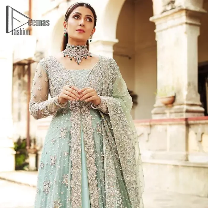 Stressed about your outfit on Walima?  Deemas Fashion will save your day. Make your moments more memorable with our ice blue front open maxi that is adorned with silver tilla, kora, and crystal work to enhance the beauty of maxi. In addition to this, the beauty of the square neckline of the stunning maxi speaks itself on your day. It is synchronized with the lehenga that's the border is as pretty as look in the picture. Finish this look with a dupatta that personifies the delicate embroidery on four sides and sequins detailing all over just to save your memorable day and give you a fairy look.