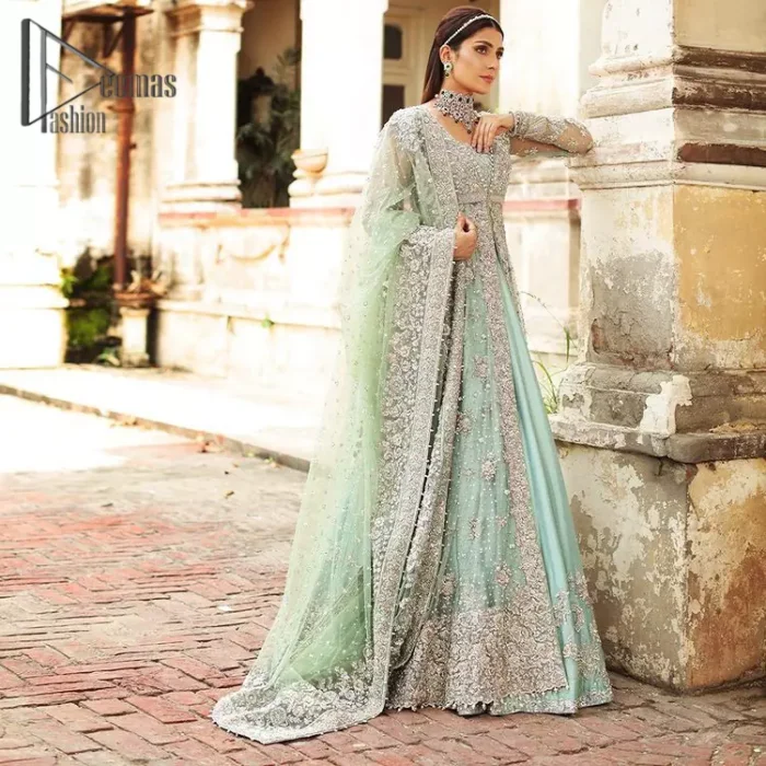 Stressed about your outfit on Walima?  Deemas Fashion will save your day. Make your moments more memorable with our ice blue front open maxi that is adorned with silver tilla, kora, and crystal work to enhance the beauty of maxi. In addition to this, the beauty of the square neckline of the stunning maxi speaks itself on your day. It is synchronized with the lehenga that's the border is as pretty as look in the picture. Finish this look with a dupatta that personifies the delicate embroidery on four sides and sequins detailing all over just to save your memorable day and give you a fairy look.