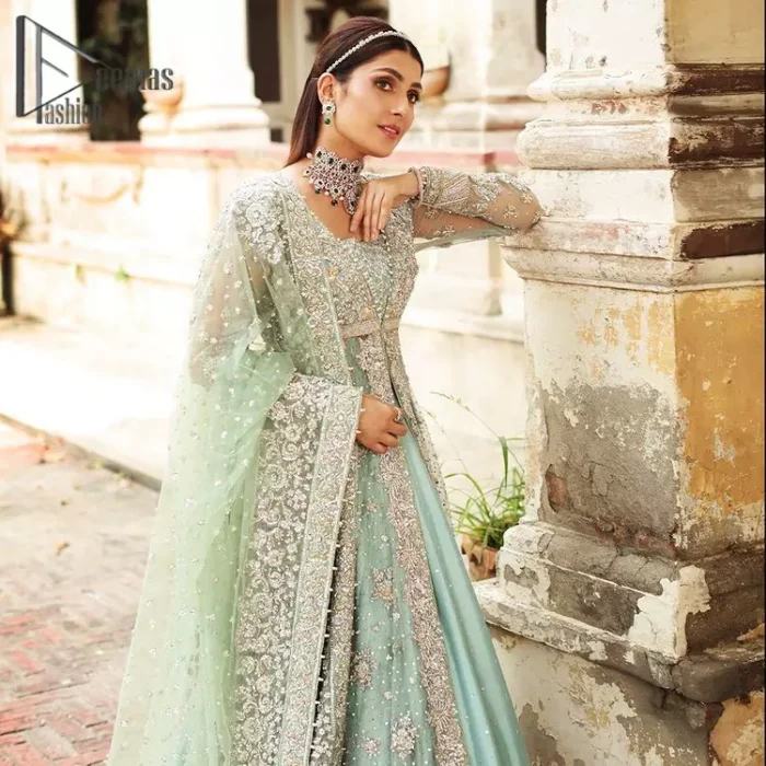 Stressed about your outfit on Walima?  Deemas Fashion will save your day. Make your moments more memorable with our ice blue front open maxi that is adorned with silver tilla, kora, and crystal work to enhance the beauty of maxi. In addition to this, the beauty of the square neckline of the stunning maxi speaks itself on your day. It is synchronized with the lehenga that's the border is as pretty as look in the picture. Finish this look with a dupatta that personifies the delicate embroidery on four sides and sequins detailing all over just to save your memorable day and give you a fairy look.
