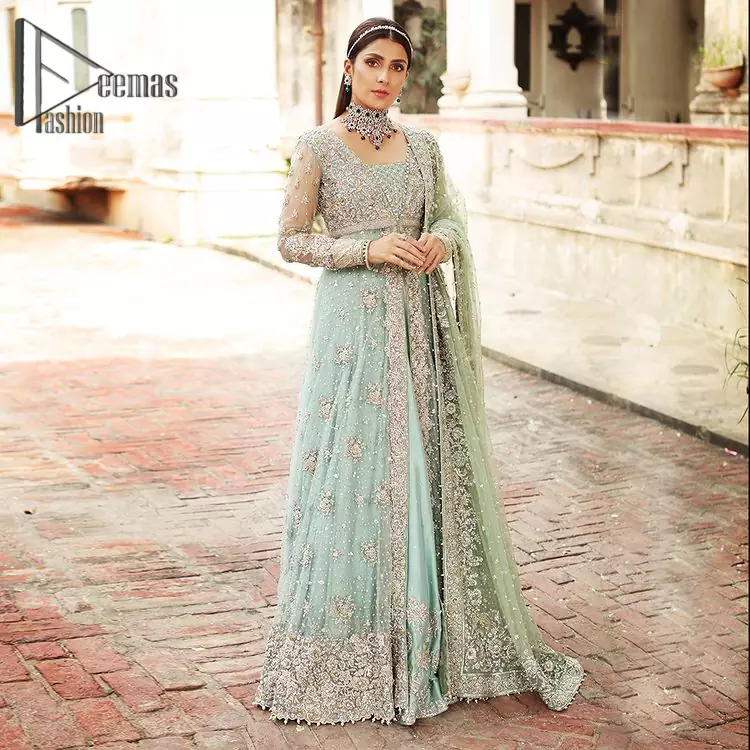 Stressed about your outfit on Walima?  Deemas Fashion will save your day. Make your moments more memorable with our ice blue front open maxi that is adorned with silver tilla, kora, and crystal work to enhance the beauty of maxi. In addition to this, the beauty of the square neckline of the stunning maxi speaks itself on your day. It is synchronized with the lehenga that's the border is as pretty as look in the picture. Finish this look with a dupatta that personifies the delicate embroidery on four sides and sequins detailing all over just to save your memorable day and give you a fairy look.
