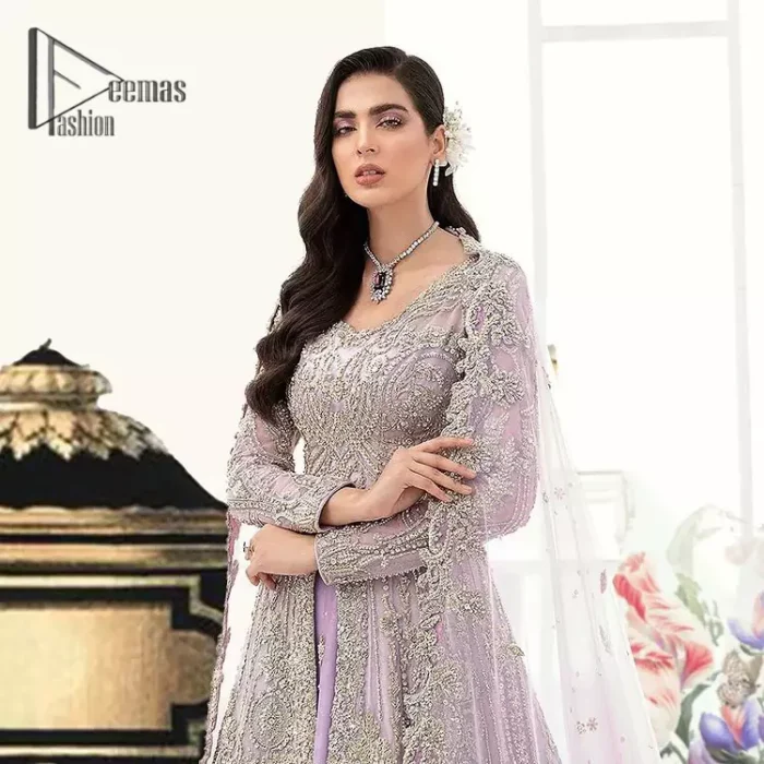 Creating the energy of modish is never been easy for a bride. So, Deemas Fashion presents the lilac front open maxi that is embellished with silver tilla, kora, and crystal soulful embroidery that all brides need for fashion. In addition to this, the V shape neckline of this maxi is looking so slayer when comes with full sleeves. Style with lilac can can lehenga that provides a glamorous look to any bride. Complete this look with a soft lilac dupatta that has a four-sided embellished border and sequins spray all over. This modish dress can be worn on your walima where you want to flaunt your style and steal everyone's heart.