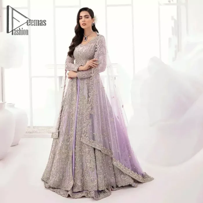 Creating the energy of modish is never been easy for a bride. So, Deemas Fashion presents the lilac front open maxi that is embellished with silver tilla, kora, and crystal soulful embroidery that all brides need for fashion. In addition to this, the V shape neckline of this maxi is looking so slayer when comes with full sleeves. Style with lilac can can lehenga that provides a glamorous look to any bride. Complete this look with a soft lilac dupatta that has a four-sided embellished border and sequins spray all over. This modish dress can be worn on your walima where you want to flaunt your style and steal everyone's heart.