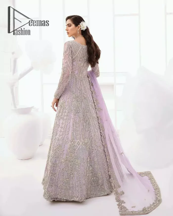 Creating the energy of modish is never been easy for a bride. So, Deemas Fashion presents the lilac front open maxi that is embellished with silver tilla, kora, and crystal soulful embroidery that all brides need for fashion. In addition to this, the V shape neckline of this maxi is looking so slayer when comes with full sleeves. Style with lilac can can lehenga that provides a glamorous look to any bride. Complete this look with a soft lilac dupatta that has a four-sided embellished border and sequins spray all over. This modish dress can be worn on your walima where you want to flaunt your style and steal everyone's heart.
